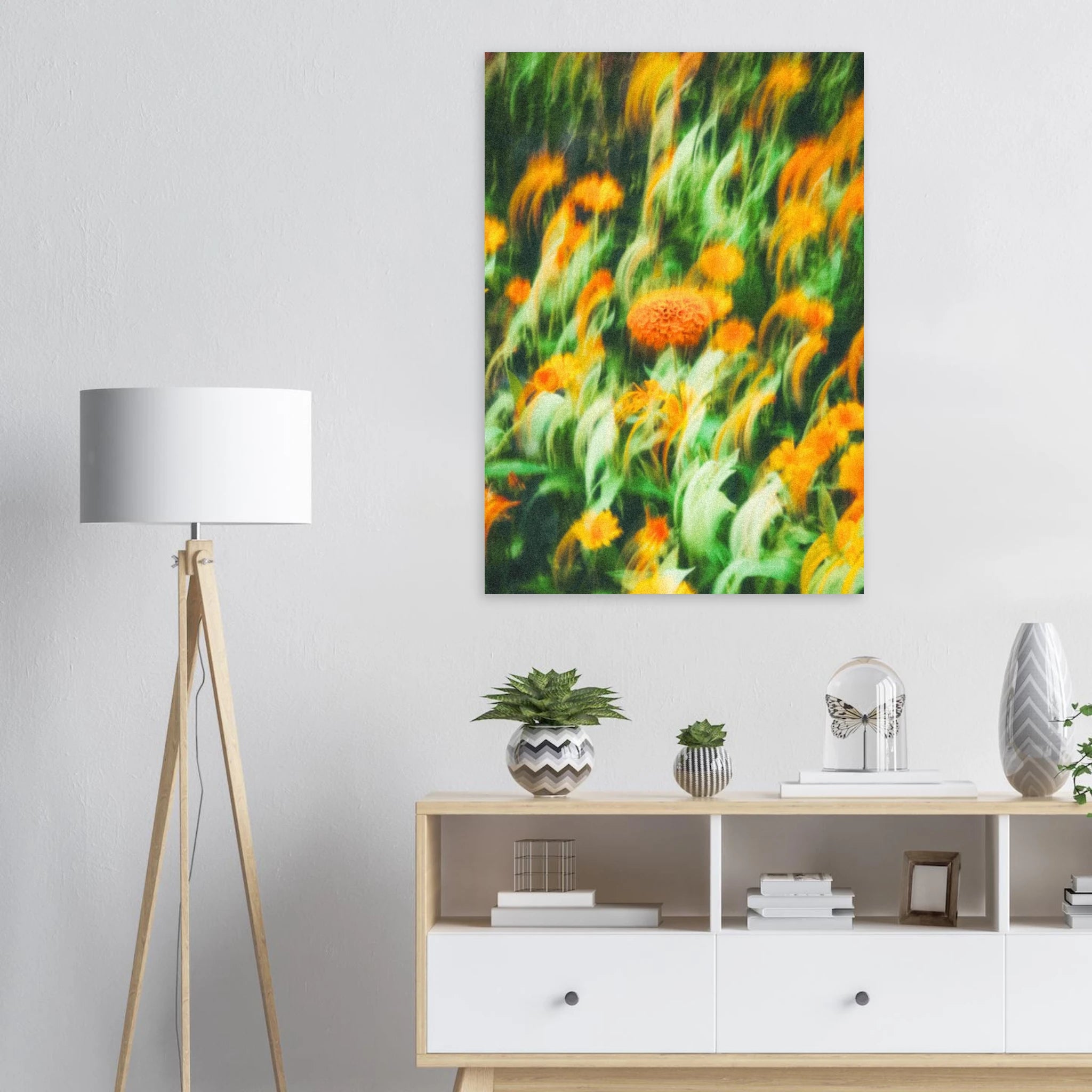 Floral artwork poster on a wall above a wooden sideboard with decorative items.